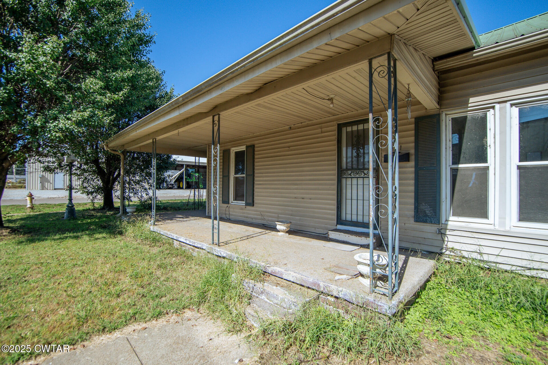 101 North Front Street Kenton, TN 38233 - Photo 2 of 30 a view of house with backyard and sitting area