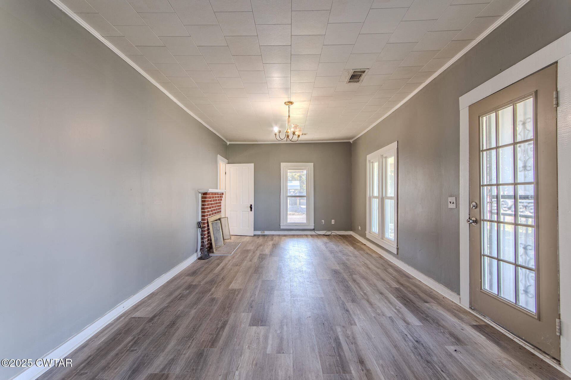 101 North Front Street Kenton, TN 38233 - Photo 4 of 30 a view of empty room with wooden floor and fan