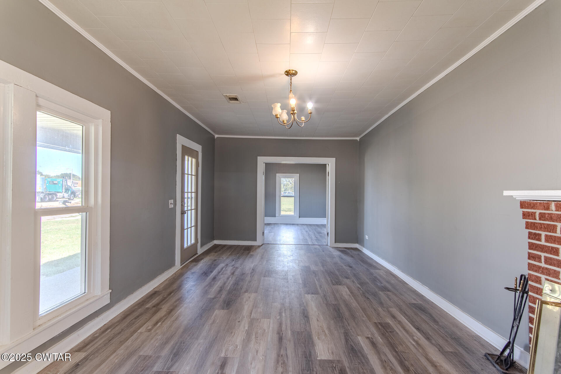 101 North Front Street Kenton, TN 38233 - Photo 5 of 30 wooden floor in an empty room with a window