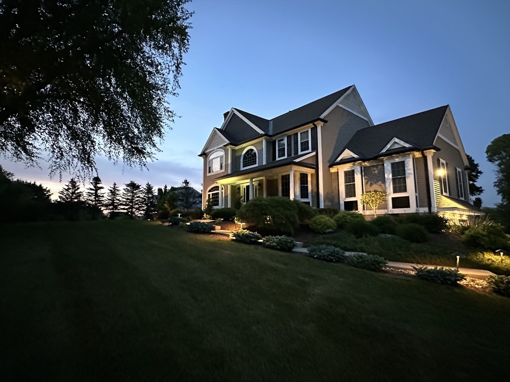 9 Round Farm Road Rehoboth, MA 02769 - Photo 5 of 41 a front view of a house with a garden