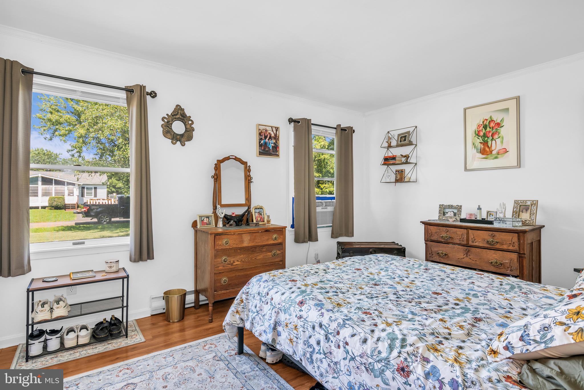 6135 Summit Street Tilghman, MD 21671 - Photo 18 of 31 a bedroom with a bed and wooden floor