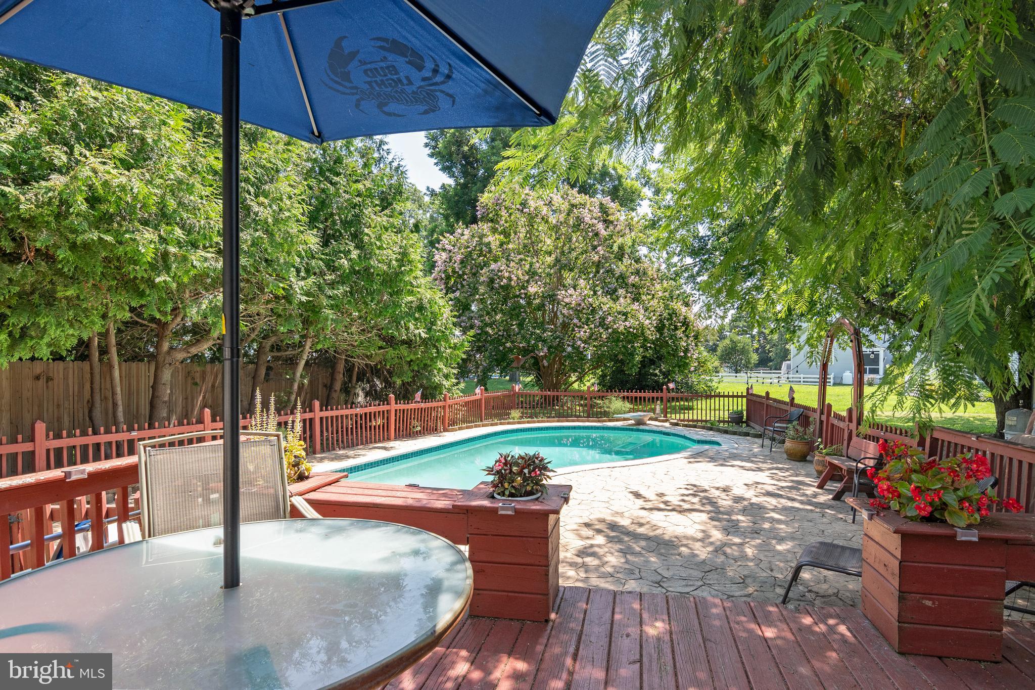6135 Summit Street Tilghman, MD 21671 - Photo 23 of 31 a swimming pool with outdoor seating and yard