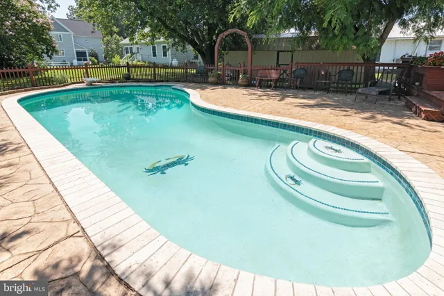 a view of a swimming pool with a patio