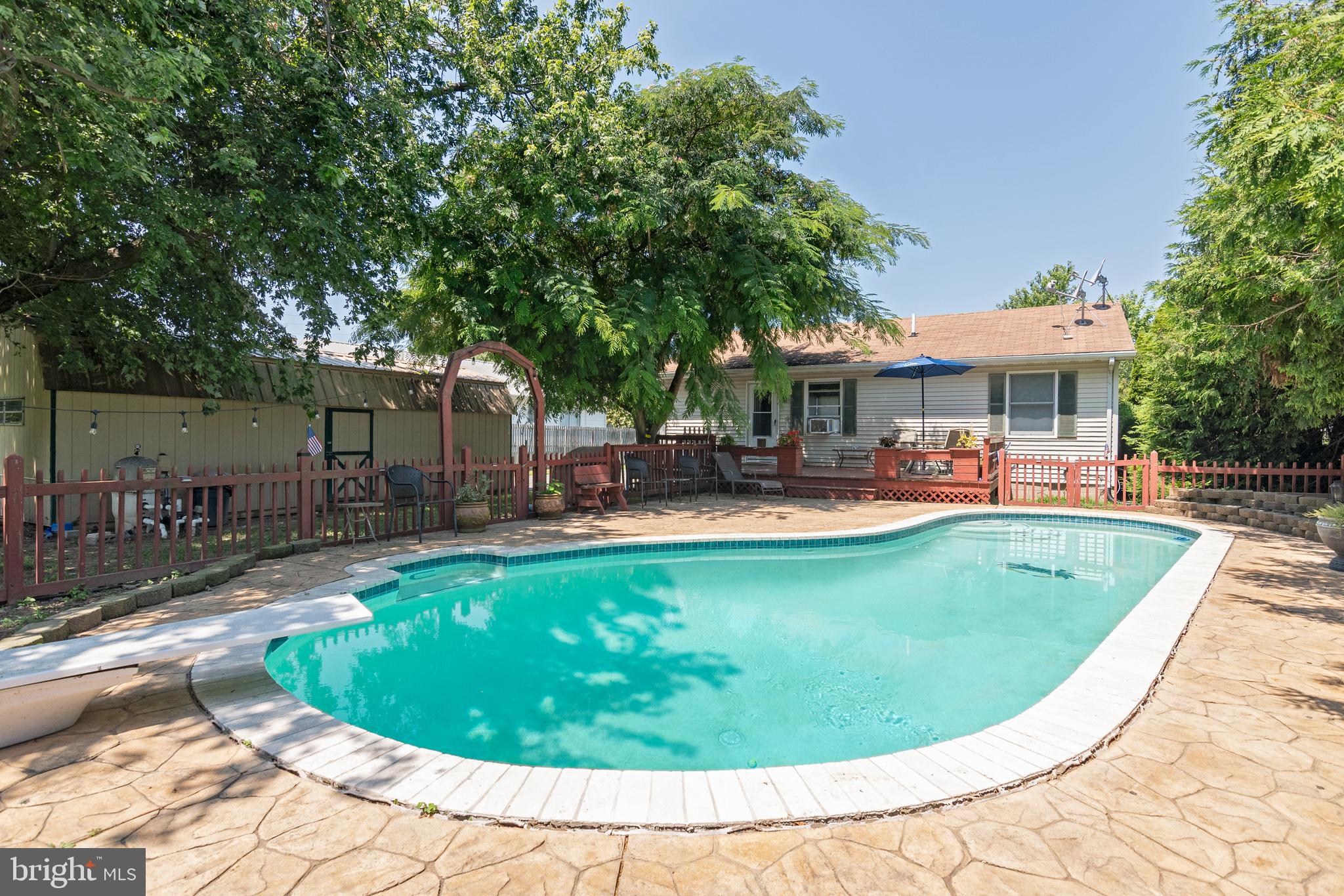 6135 Summit Street Tilghman, MD 21671 - Photo 26 of 31 a view of a swimming pool with a patio