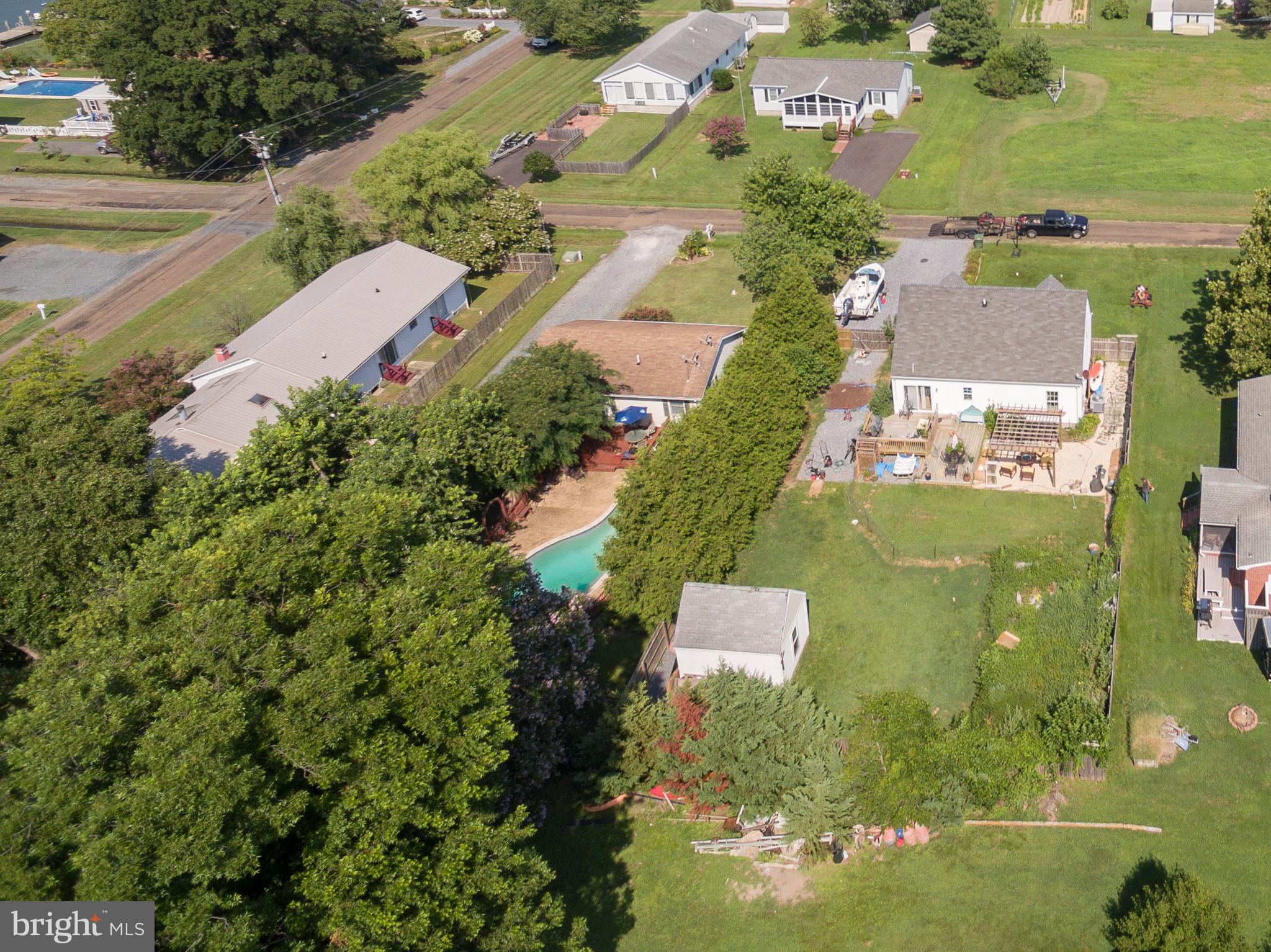 6135 Summit Street Tilghman, MD 21671 - Photo 7 of 31 an aerial view of residential houses with outdoor space and street view