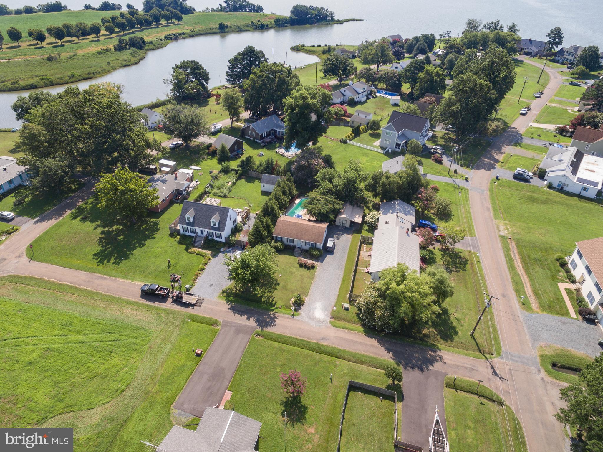 6135 Summit Street Tilghman, MD 21671 - Photo 8 of 31 an aerial view of residential houses with outdoor space and lake view