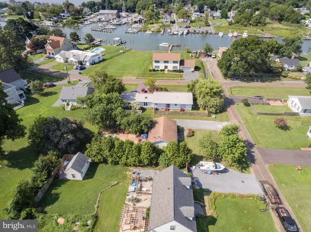 an aerial view of a houses and an outdoor space