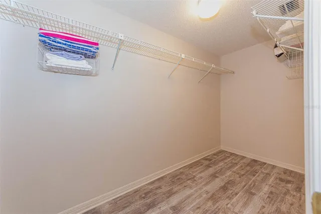 a room that has a closet and wooden floor