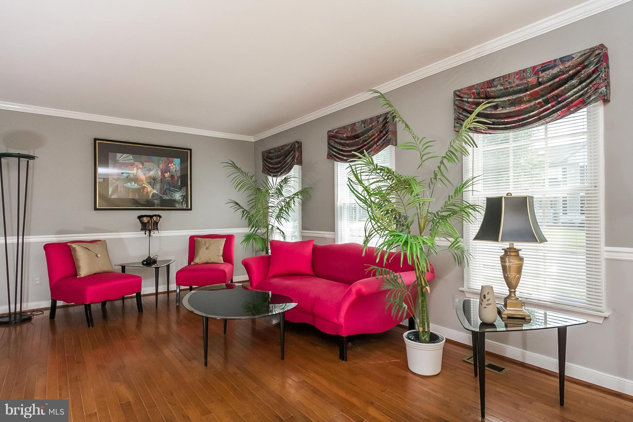 9108 Gardenia Road Baltimore, MD 21236 - Photo 3 of 26 a living room with furniture and wooden floor