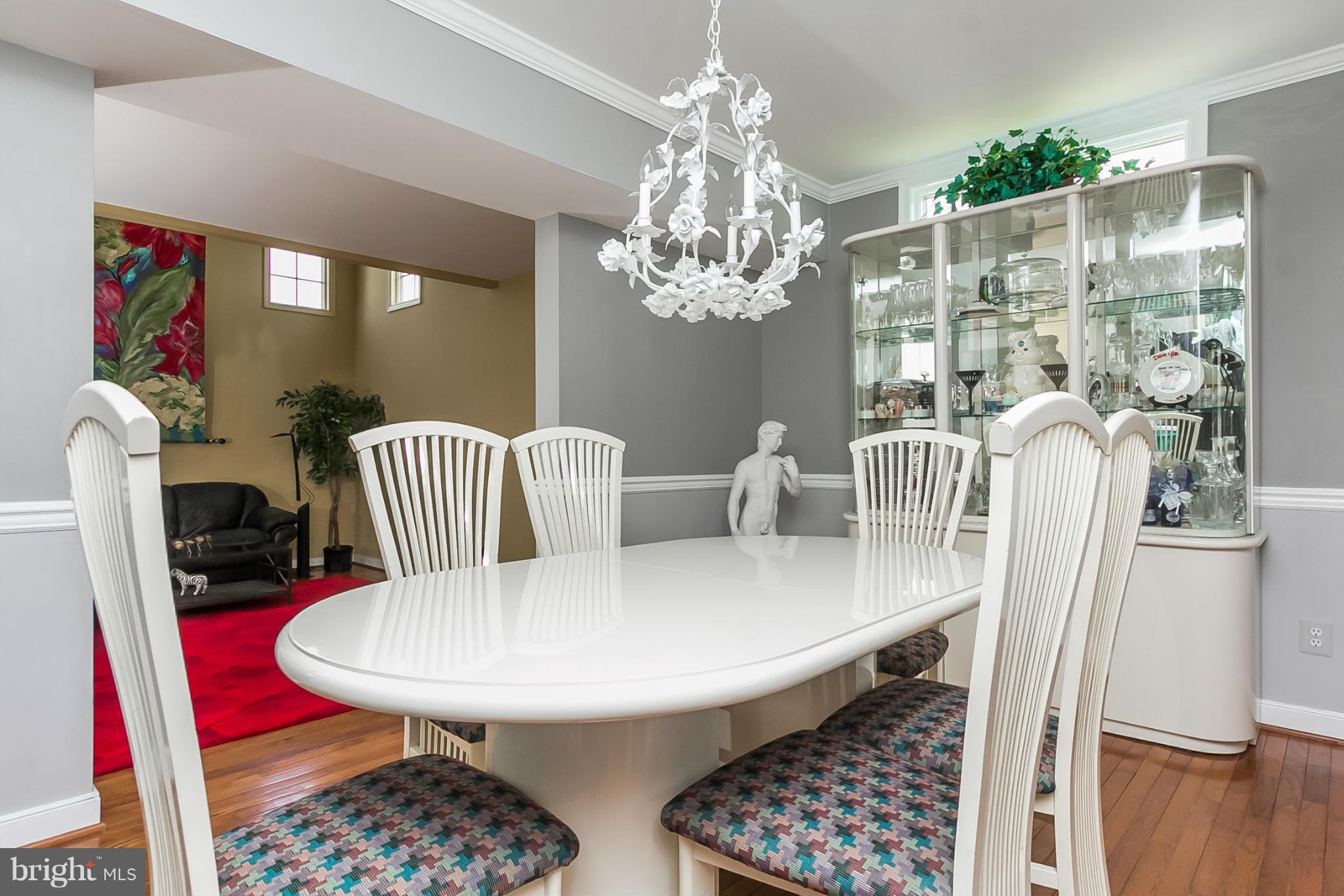 9108 Gardenia Road Baltimore, MD 21236 - Photo 8 of 26 a view of a dining room with furniture and chandelier