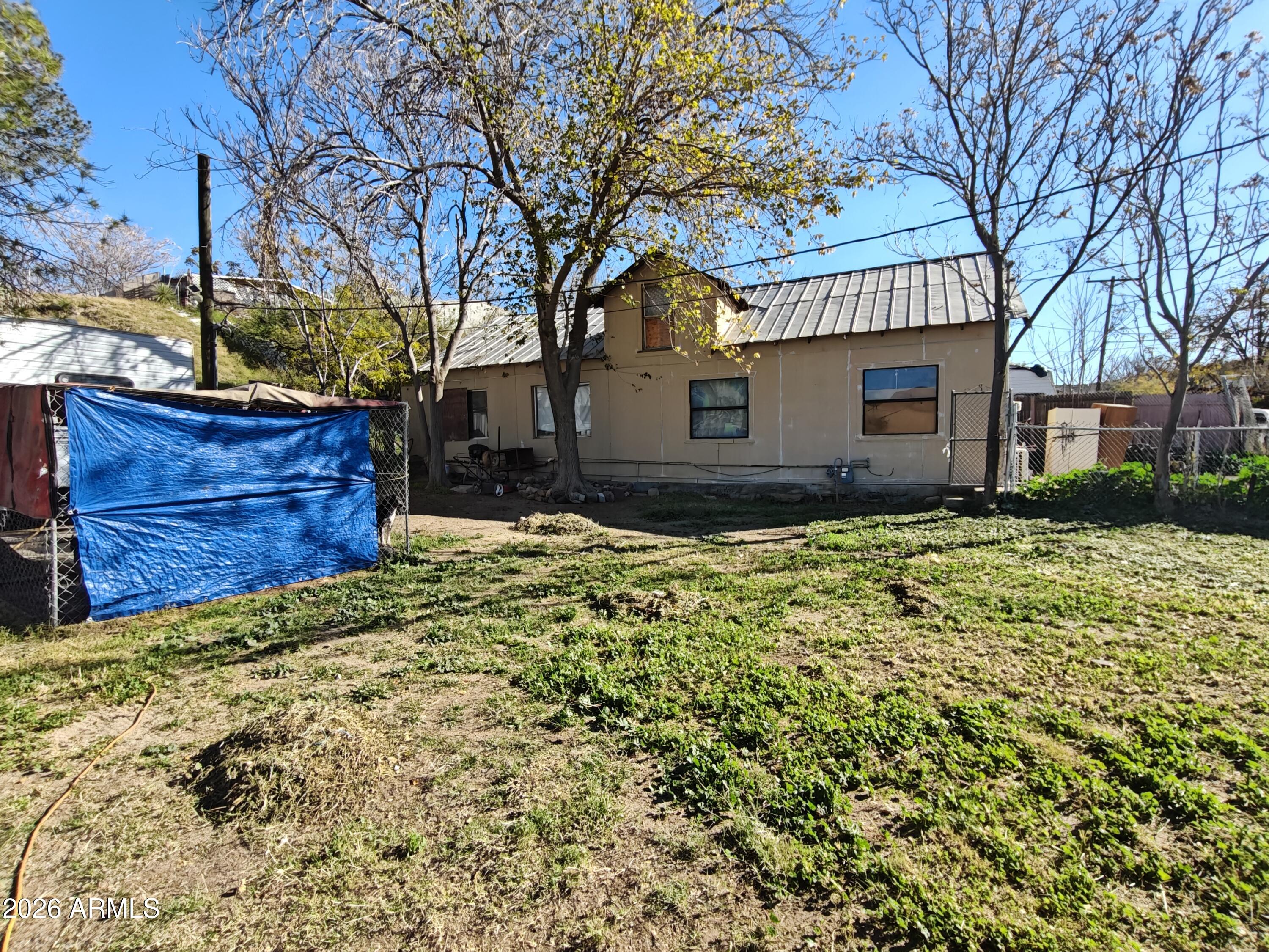 5676 Globe Canyon Road Globe, AZ 85501 - Photo 2 of 3 a view of a house with a yard