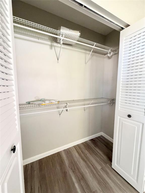84 Mansfield A, Unit 84 Boca Raton, FL 33434 - Photo 15 of 24 a view of a room with wooden floor and white walls
