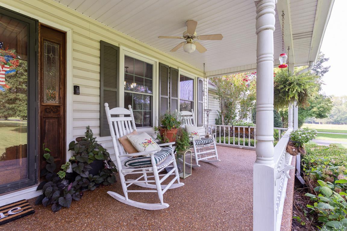 2120 Cairo Bend Road Lebanon, TN 37087 - Photo 2 of 30 a view of a porch with chairs and potted plants