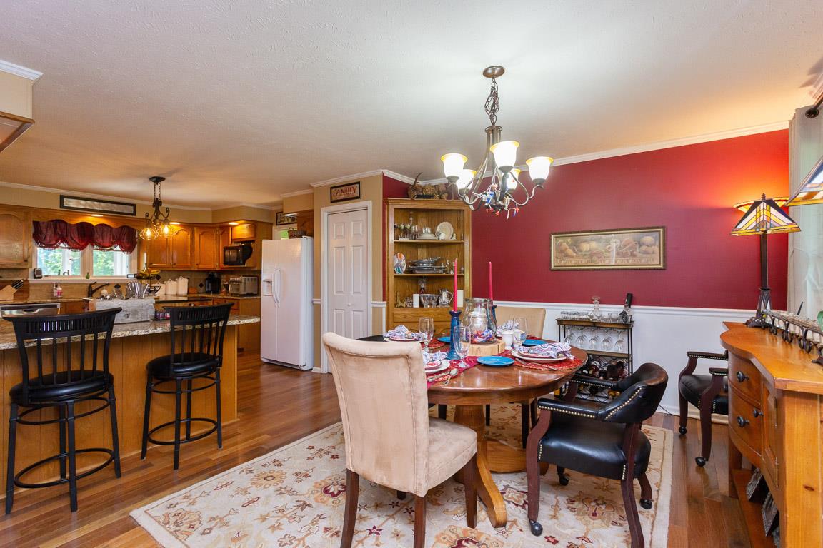 2120 Cairo Bend Road Lebanon, TN 37087 - Photo 12 of 30 a view of a dining room with furniture and chandelier