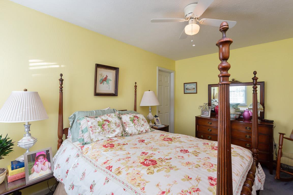 2120 Cairo Bend Road Lebanon, TN 37087 - Photo 18 of 30 a bedroom with a bed and a lamp on table