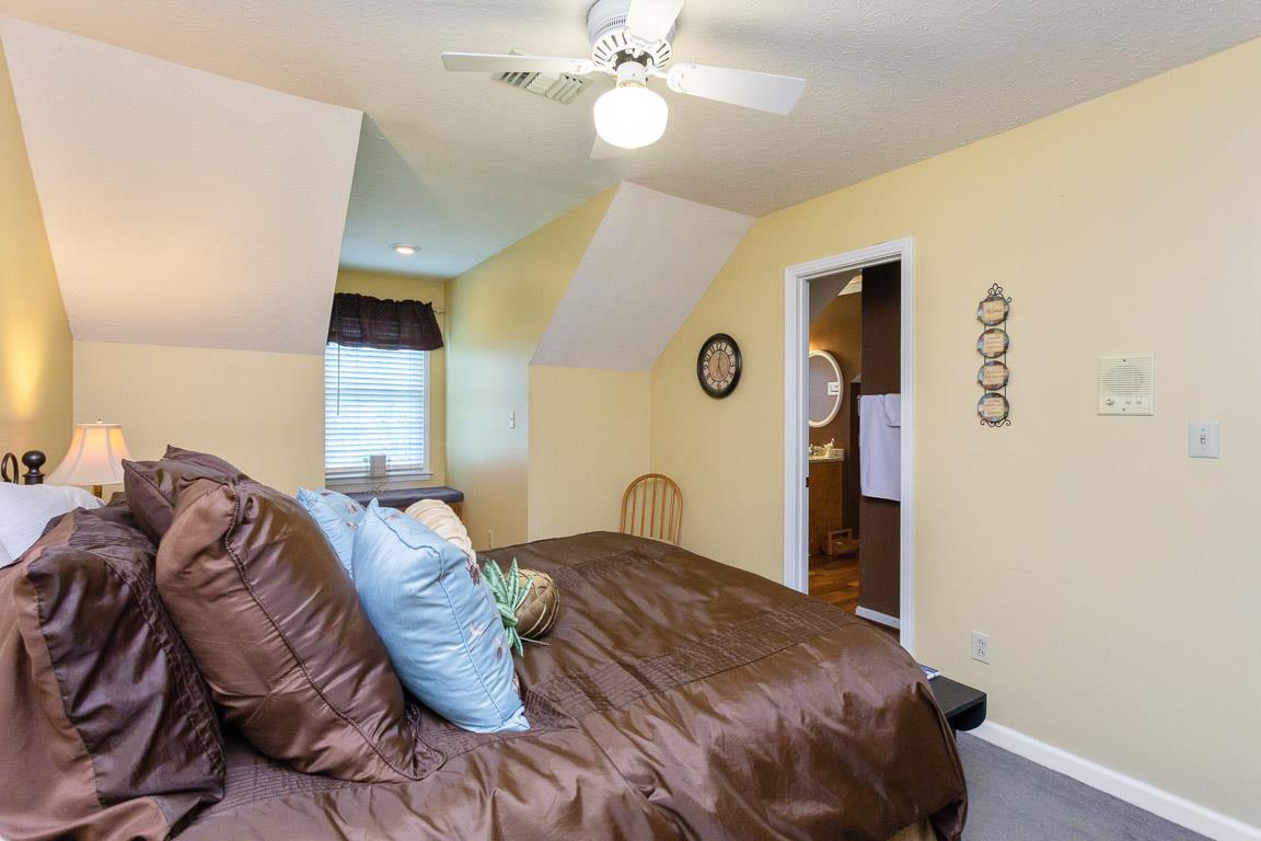 2120 Cairo Bend Road Lebanon, TN 37087 - Photo 19 of 30 a bedroom with a bed and a chandelier