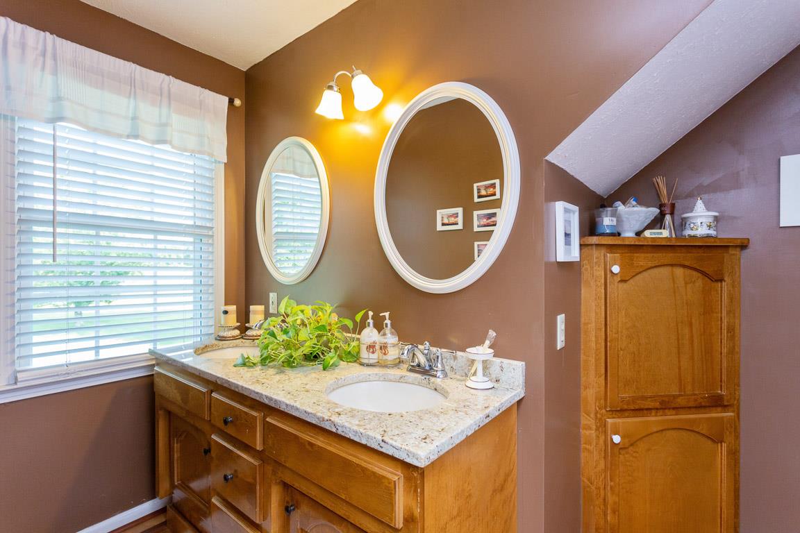 2120 Cairo Bend Road Lebanon, TN 37087 - Photo 20 of 30 a bathroom with a sink and a mirror