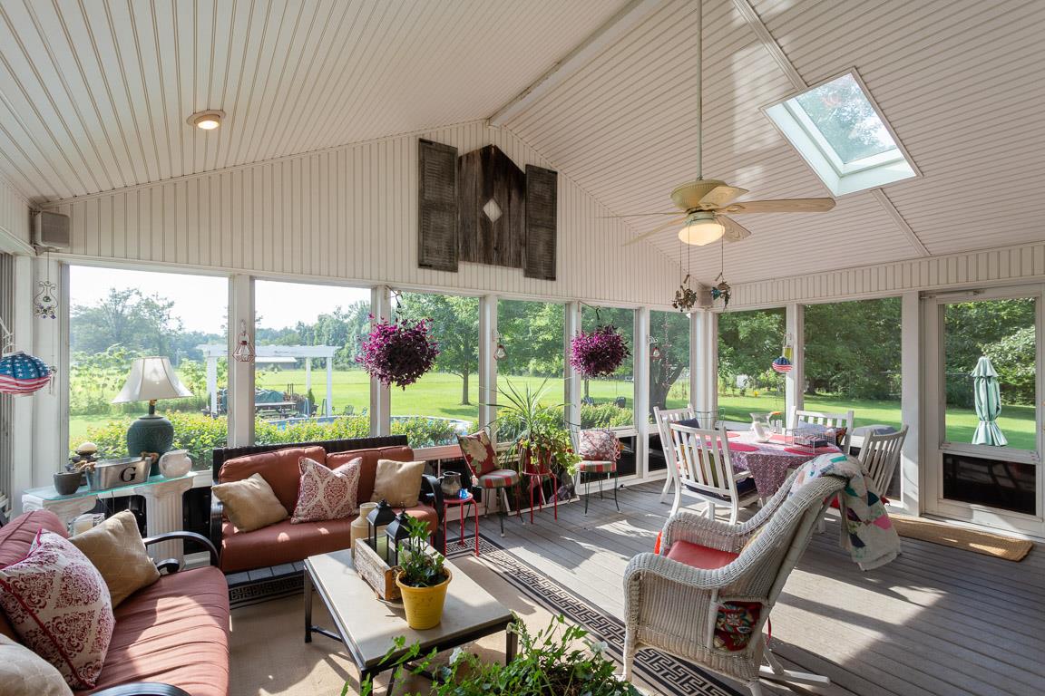 2120 Cairo Bend Road Lebanon, TN 37087 - Photo 3 of 30 a living room with furniture large windows and a flat screen tv