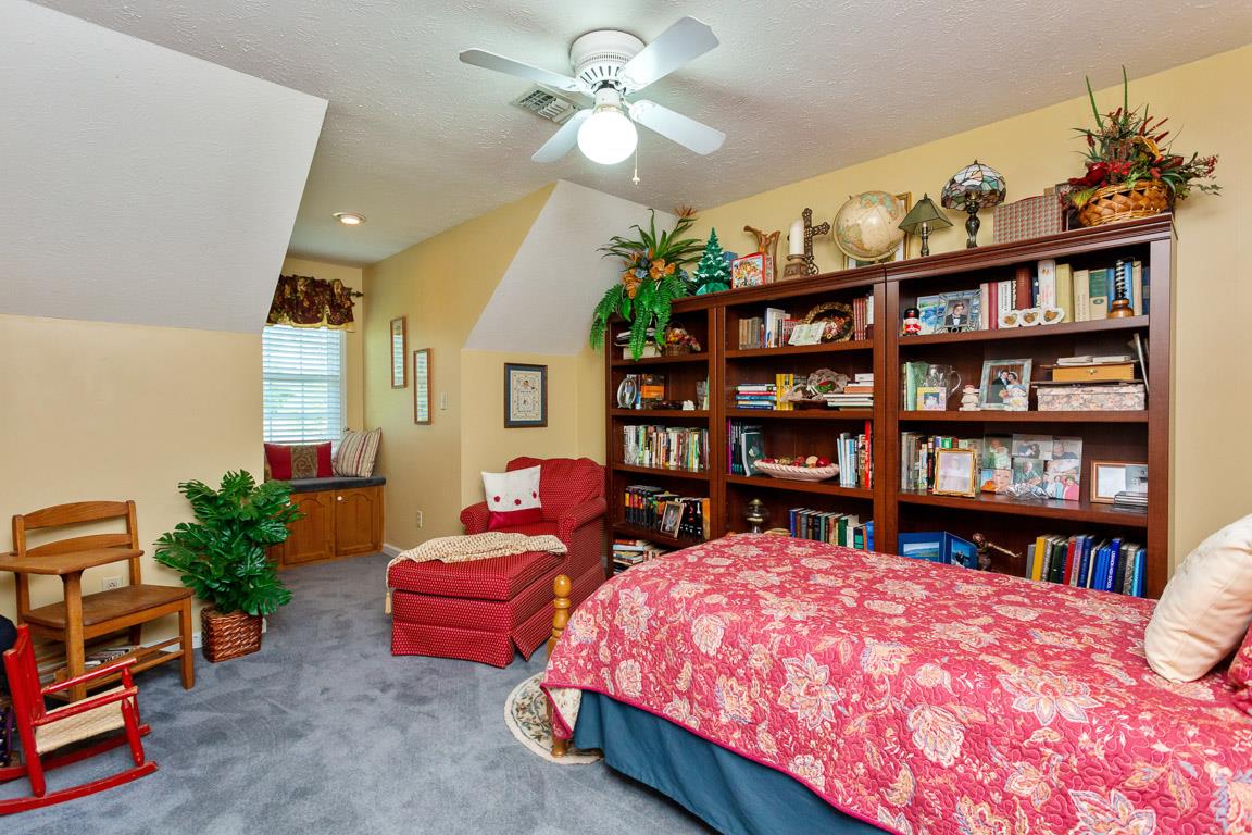 2120 Cairo Bend Road Lebanon, TN 37087 - Photo 22 of 30 a bedroom with bed and a book shelf