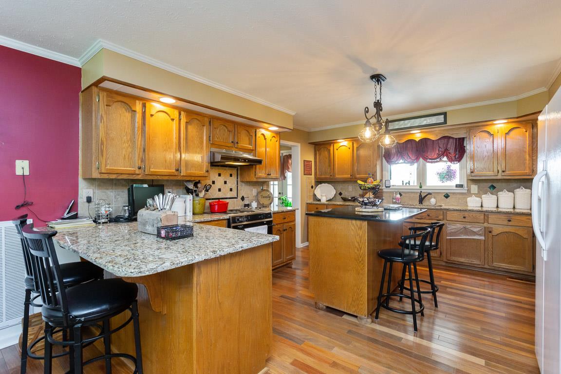 2120 Cairo Bend Road Lebanon, TN 37087 - Photo 4 of 30 a kitchen with a table chairs and wooden floor