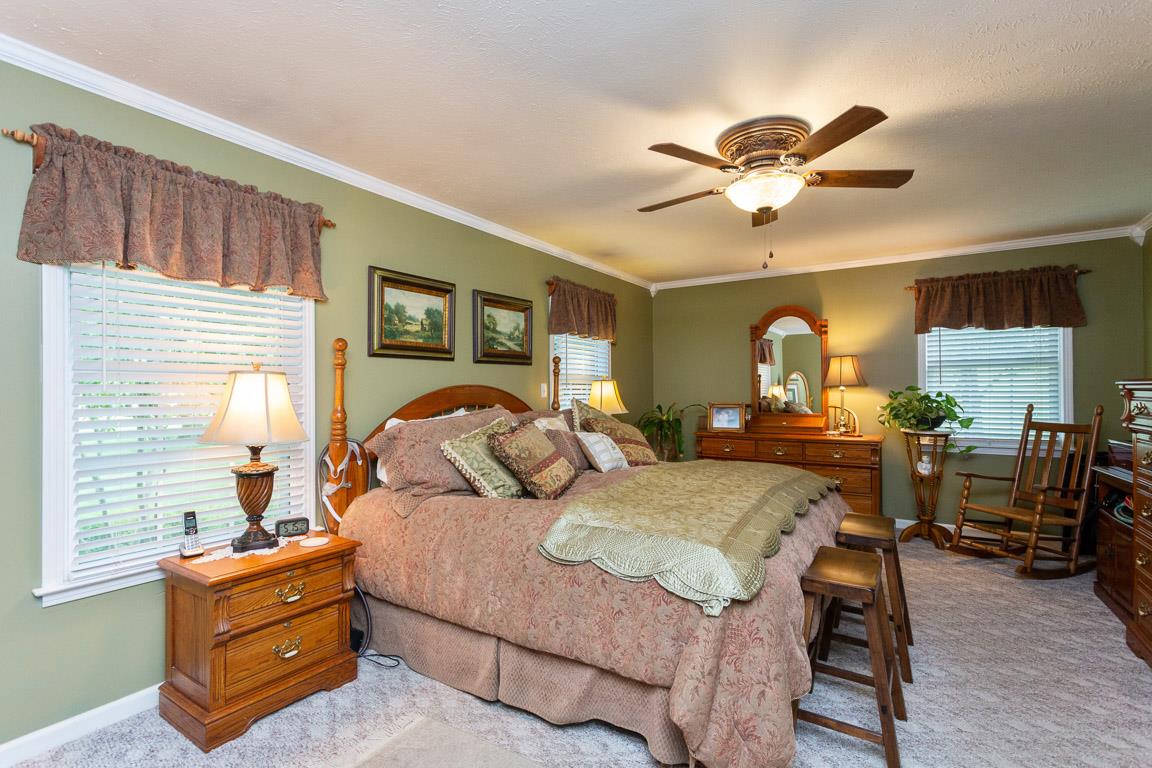 2120 Cairo Bend Road Lebanon, TN 37087 - Photo 5 of 30 a bedroom with a bed and a chandelier
