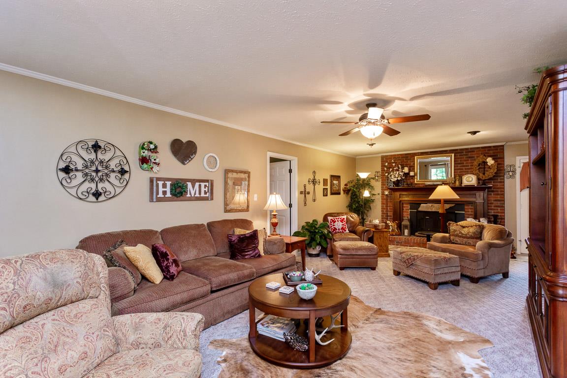 2120 Cairo Bend Road Lebanon, TN 37087 - Photo 8 of 30 a living room with furniture a rug and white walls
