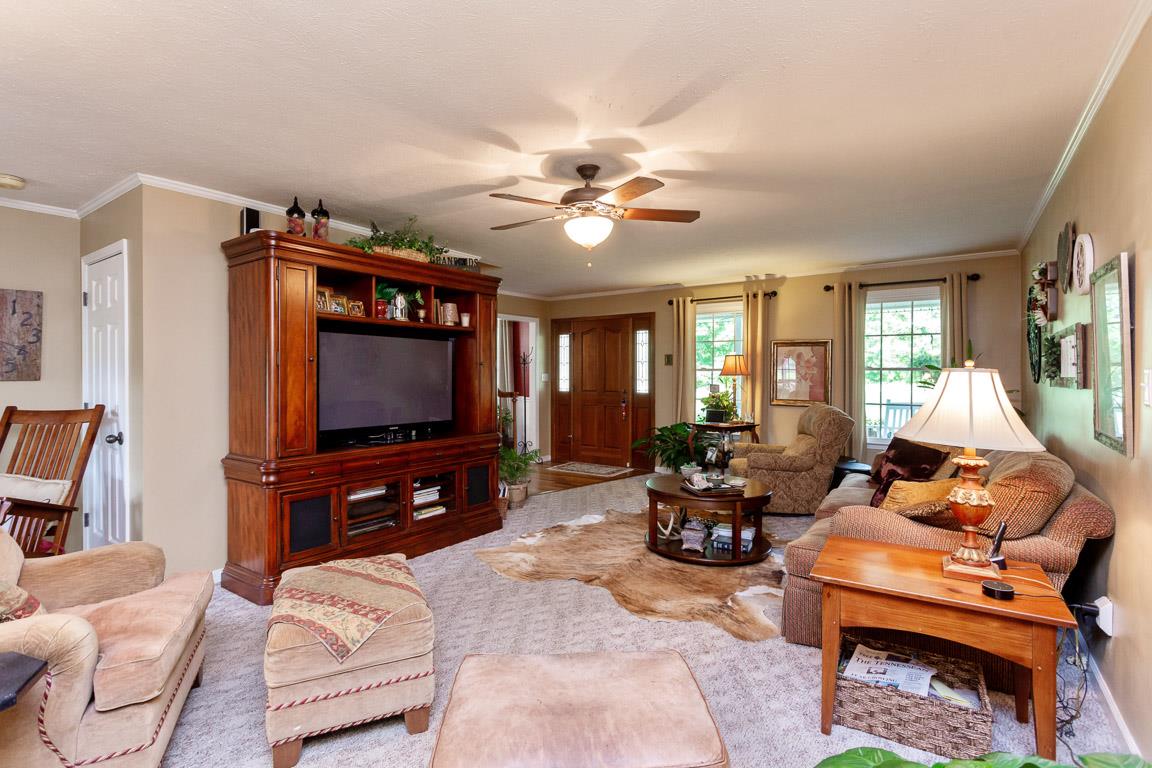 2120 Cairo Bend Road Lebanon, TN 37087 - Photo 9 of 30 a living room with furniture and a flat screen tv
