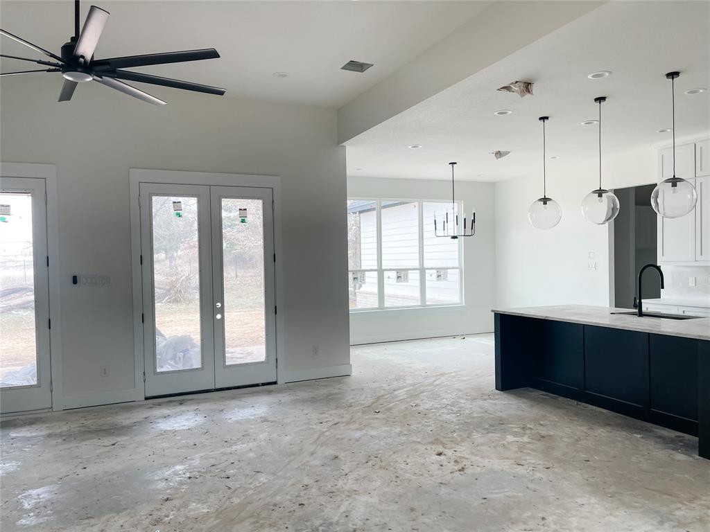 4072 County Road Cleburne, TX 76031 - Photo 10 of 20 a view of a big room with windows and cabinet