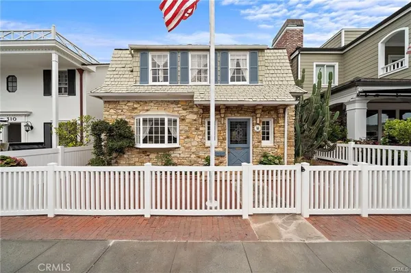 front view of a brick house with a street