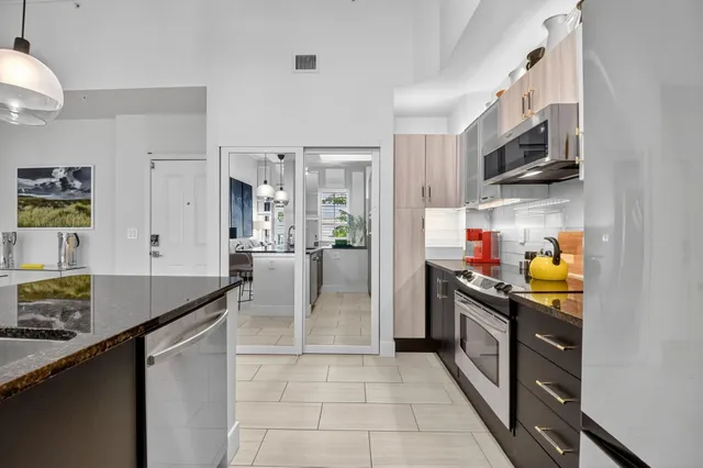 a bedroom with a bed and a mirror