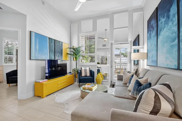 a bedroom with a large bed and a wooden floor