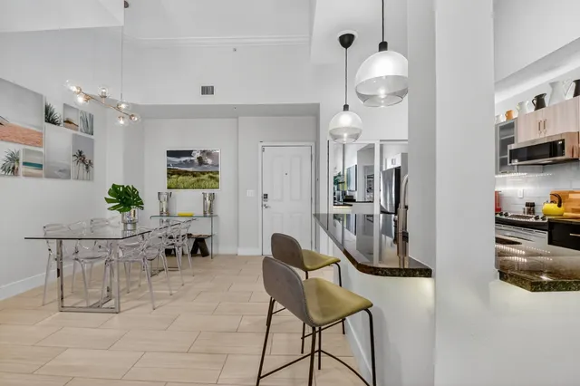 a view of kitchen with furniture and natural light
