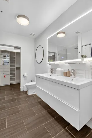 a bathroom with a sink toilet and shower