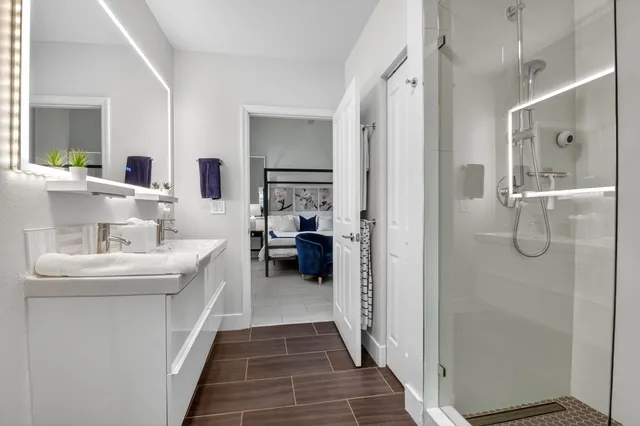 a view of bathroom with a potted plant and a shower