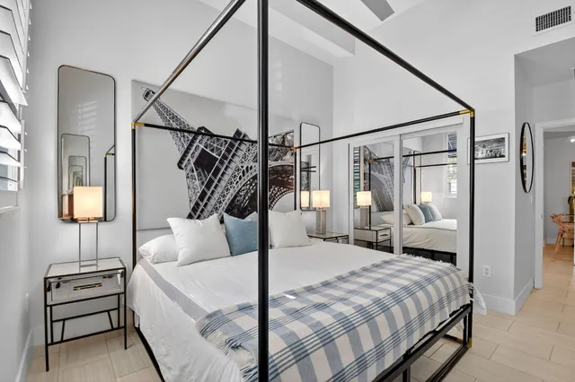 a living room with furniture potted plant and a chandelier