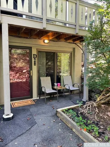 a view of a brick building with a bench in front of it