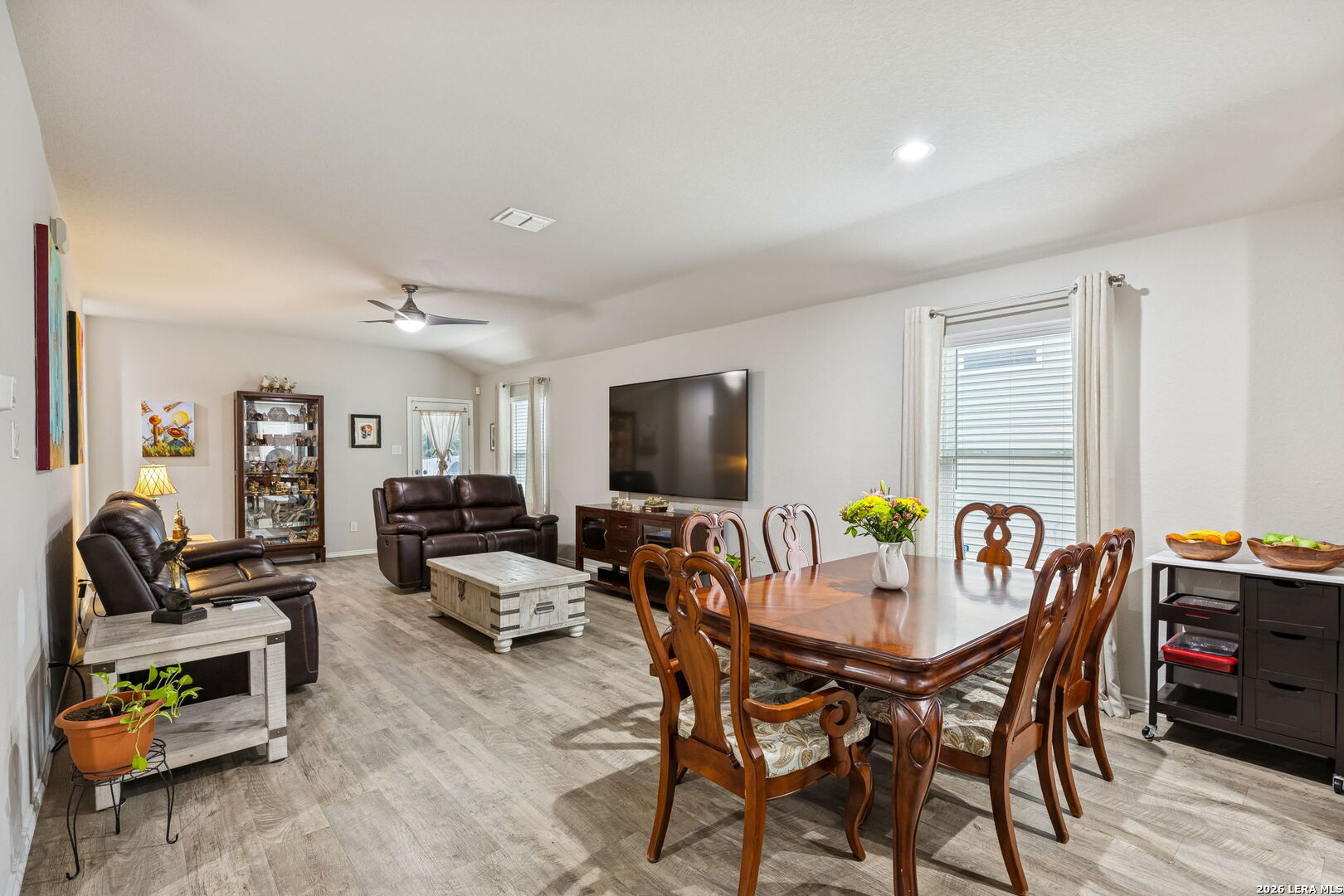 2026 Rhesus View San Antonio, TX 78245 - Photo 11 of 39 a view of a dining room with furniture and wooden floor