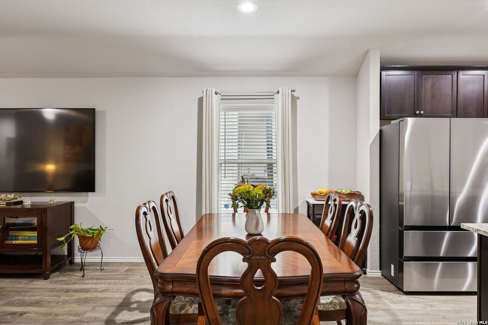 2026 Rhesus View San Antonio, TX 78245 - Photo 12 of 39 a dining room with furniture and chandelier