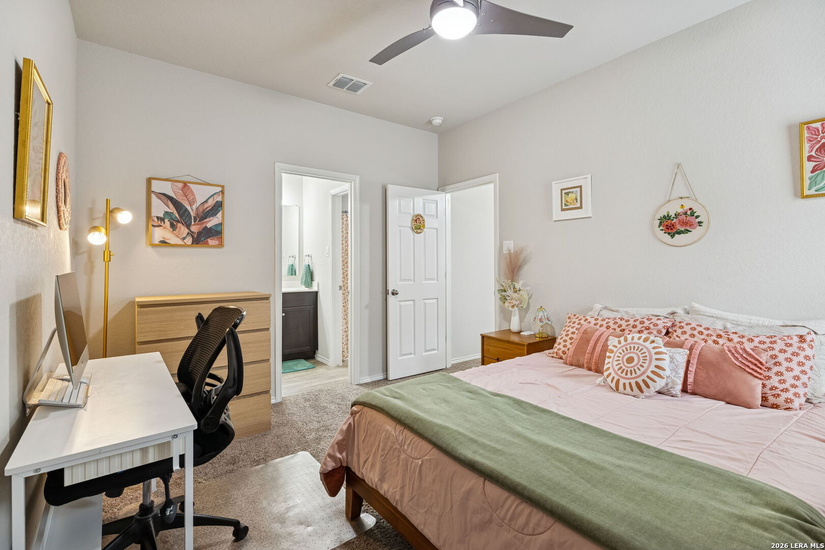 2026 Rhesus View San Antonio, TX 78245 - Photo 26 of 39 a bedroom with a bed and a chair