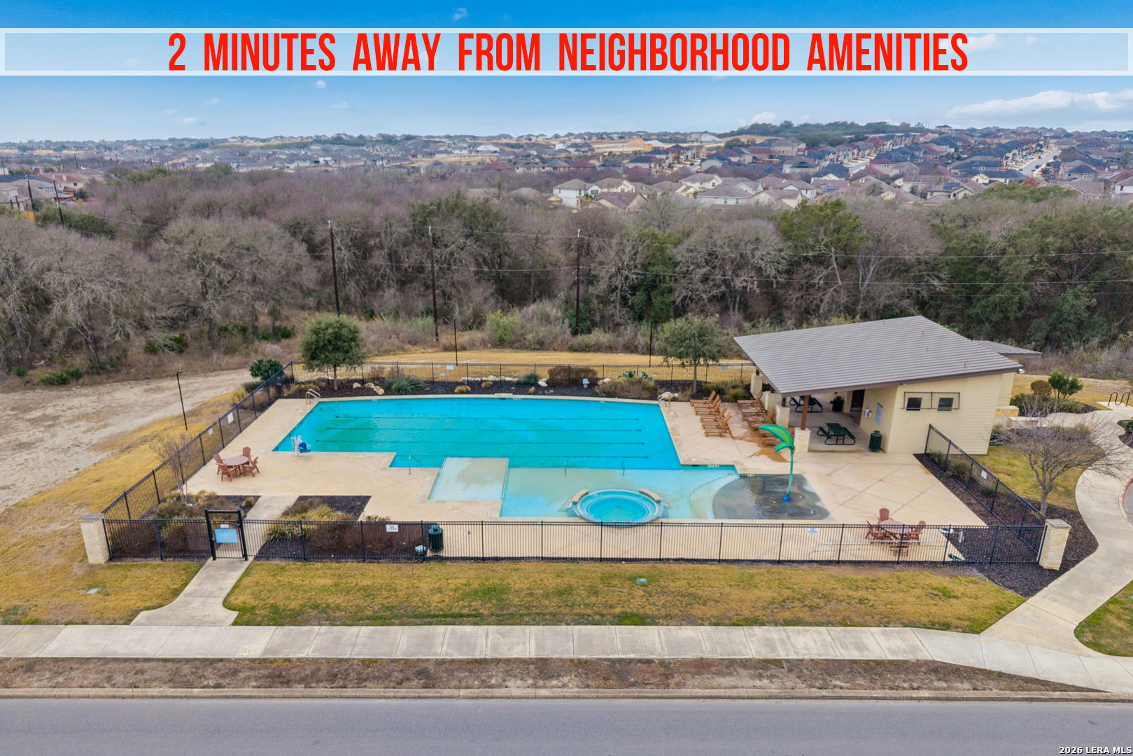 2026 Rhesus View San Antonio, TX 78245 - Photo 35 of 39 a view of a swimming pool and a yard