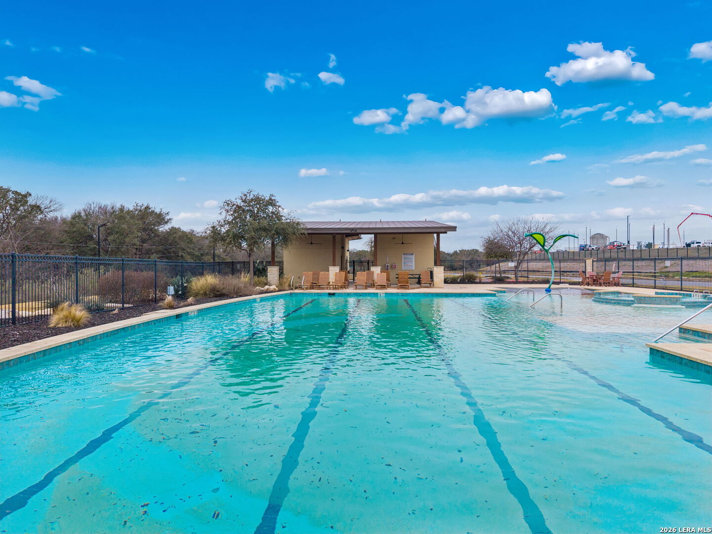 2026 Rhesus View San Antonio, TX 78245 - Photo 38 of 39 a view of a house with a swimming pool