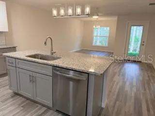 a kitchen with sink and window