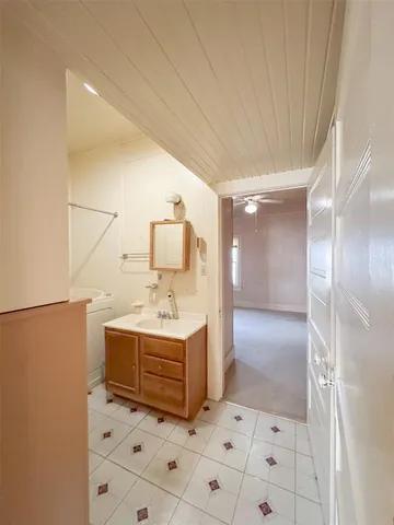 a bathroom with a shower and a sink