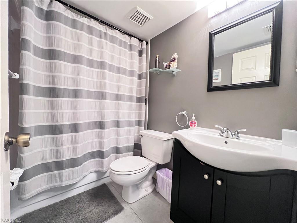 717 Landover Circle, Unit 103 Naples, FL 34104 - Photo 12 of 18 Guest Bedroom