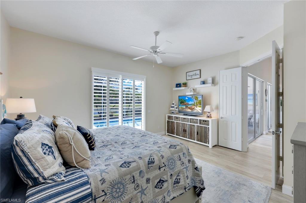 3108 Dominica Way Naples, FL 34119 - Photo 12 of 39 Bright interior space featuring light-toned walls and wood-finish flooring