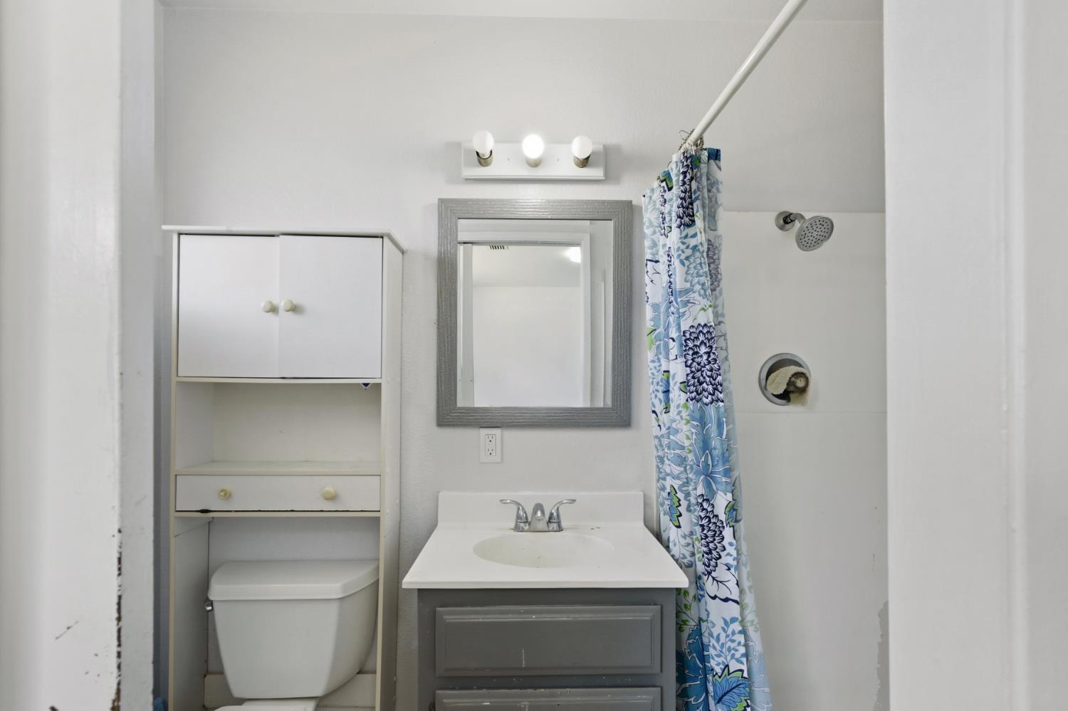 7208 7th Street Rio Linda, CA 95673 - Photo 16 of 41 a bathroom with a sink a toilet and shower