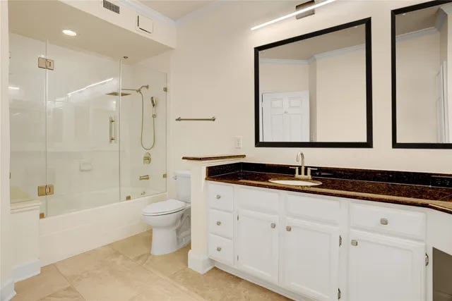 a bathroom with a double vanity sink and a bathtub
