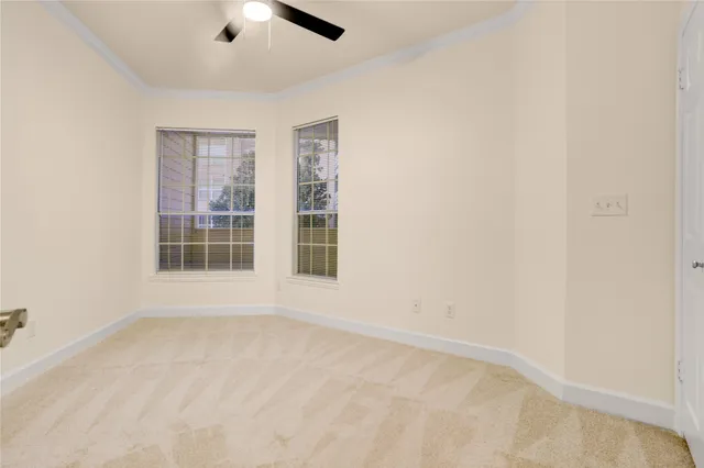 an empty room with windows and closet
