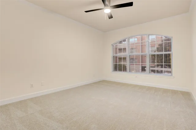 an empty room with a empty space and windows