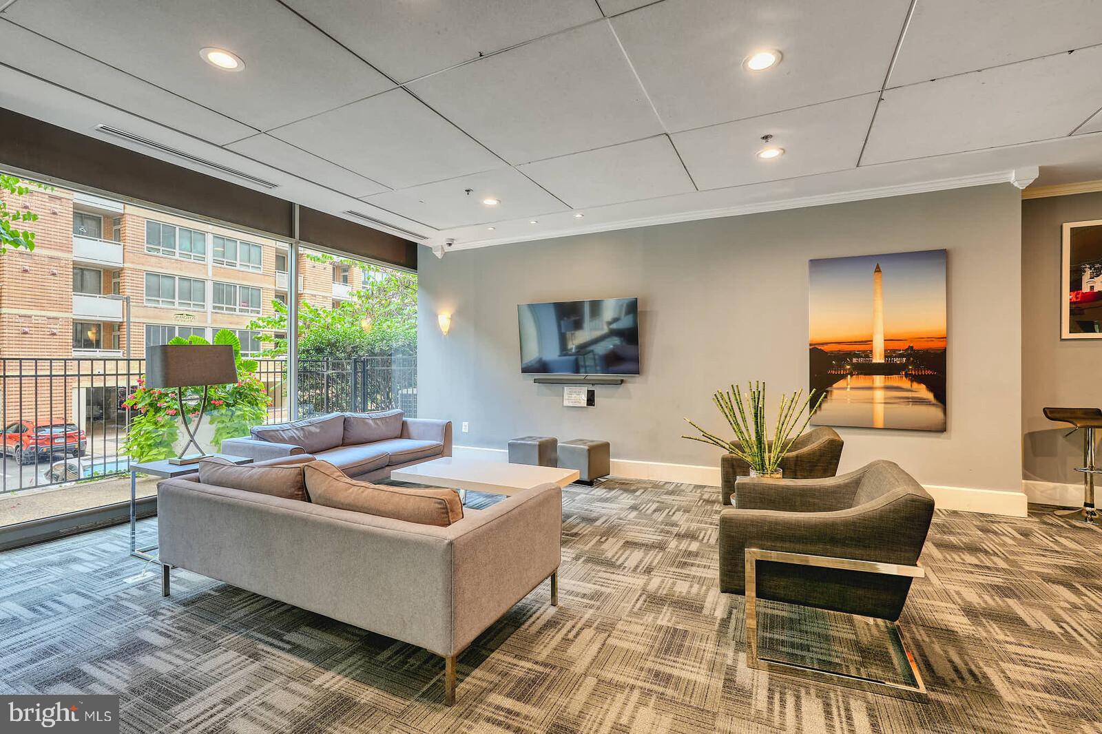 800 4th Street Southwest, Unit S623 Washington, DC 20024 - Photo 21 of 49 a living room with furniture and a large window